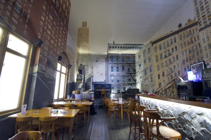 The huge, 360-degree illusion mural was created by Jean-Michel Verrett, covering the walls, the floor, and even the ceiling. The mural was created in 1992 based on the artist's own photo.