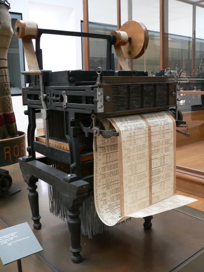 This loom was invented in 1801 by Monsieur Jacquard for weaving textiles. The loom was controlled by holes punched in paper, similar to the punch cards used in early IBM computers.
