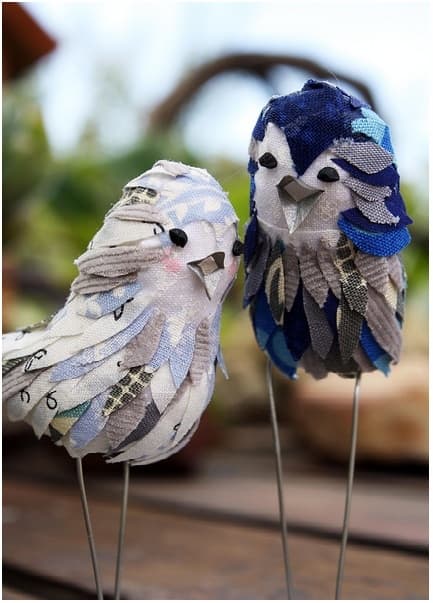 These are actually cake toppers, but they would be just as cute as decorations for a table, windowsill or mantelpiece. You just need to shape the bodies out of clay, paper mache, foam or other material, and then decorate them.