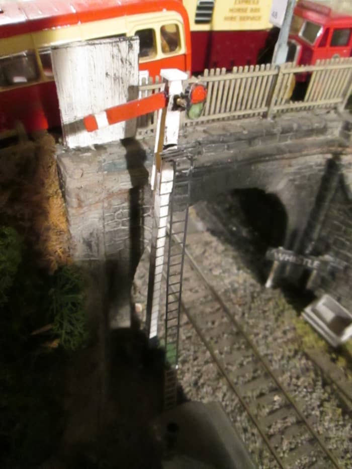 Ayton Row down starter with sighting board beside the road bridge - 'capping' replaces original post-top finial