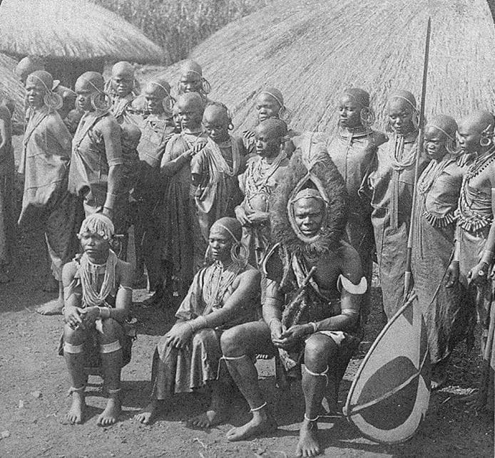 Chief Wambugu wa Mathangani in 1902 with his sixteen wives. Notice the headgear made of ostrich feathers.... And the girls are beautiful, especially the third one from right. Image Credit: Godfrey Muriuki and Neal Sobania