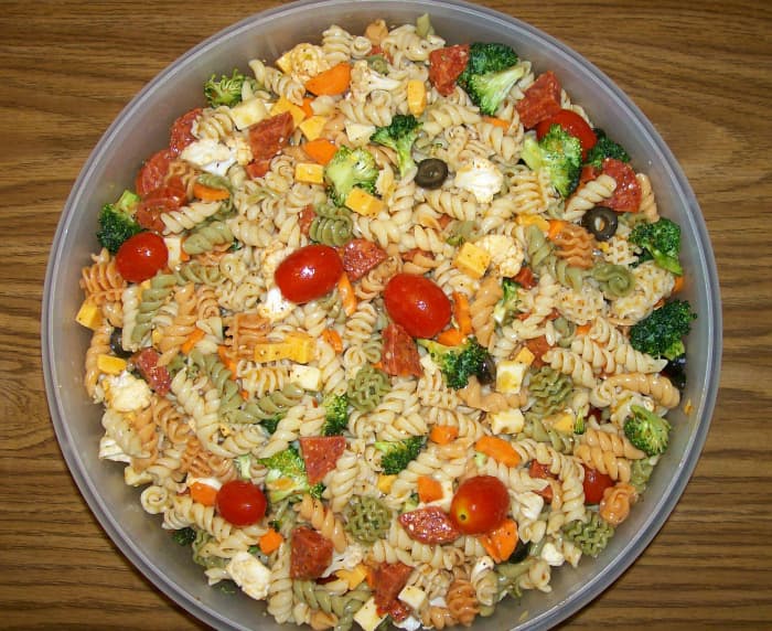 I mixed everything in a large Tupperware "That's a Bowl" and then transferred the final Supreme Pasta Salad to a pretty, green glass bowl.