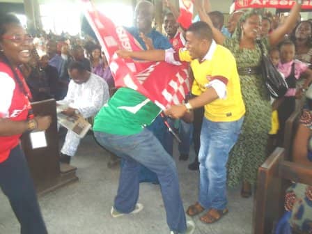 'Crazy' Arsenal fans in thanksgiving celebration inside a church. I wonder what they are "thanking" God for...
