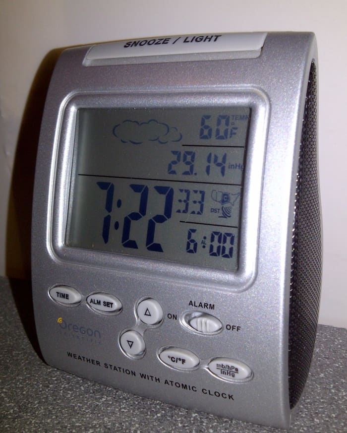 Oregon Scientific alarm clock with barometric pressure sensor and thermometer provides weather forecasts