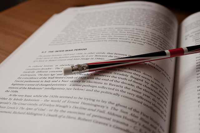 A pen, pencil, sticky notes, and highlighter are handy tools for researching for a paper.
