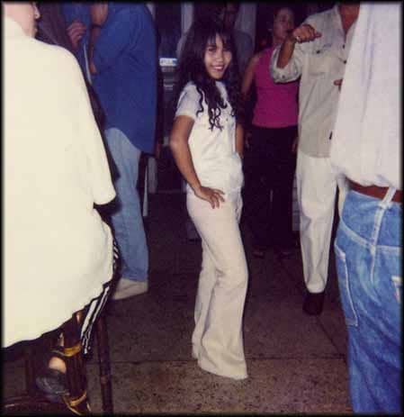 Loon, aged 15, waits for customers in a Bangkok nightclub two years after selling her virginity for a few hundred dollars