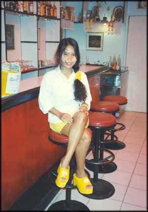 Lon working as a bar girl, aged 17, some four years after selling her virginity for a few hundred dollars