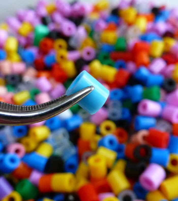 Fused beads are tiny plastic tubes - not for stringing on necklaces (though you can) but for placing onto special pegboards to make pixel patterns.