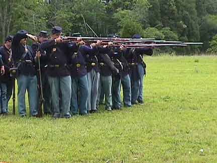 A Living History Unit prepares to Fire By Rank: the Front Rank Aims while the Rear Rank Loads (it already fired its volley)