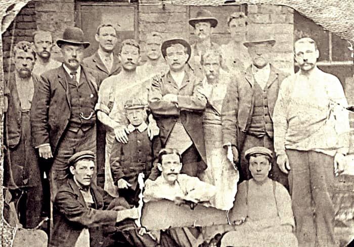 Grandad's father (pictured with workmates, we believe) in the early 20th century. His dad is the tall chap right at the back, wearing a hat.