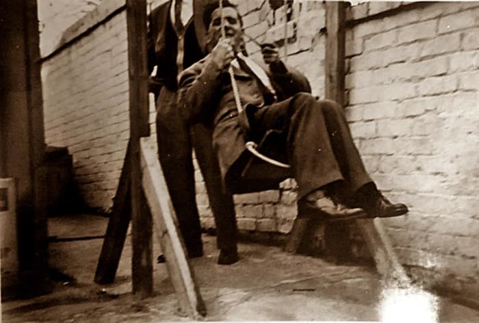 Grandad fooling around on my brother's old swing in the garden of grandma's B&B. He always had a great sense of fun. That's my brother in the background, pushing him!