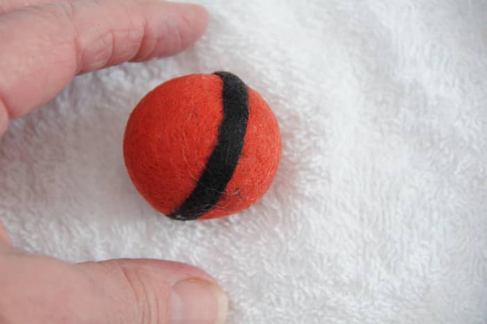 Rolling on a cloth appear to make it easier - felting happens more quickly when the project is not too wet