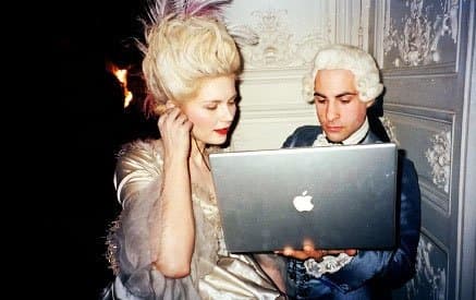 This picture shows that a Sixteenth Century couple is holding an Apple Laptop. Laptop was an unknown thing in the Sixteenth Century. Hence, it is an anachronism.