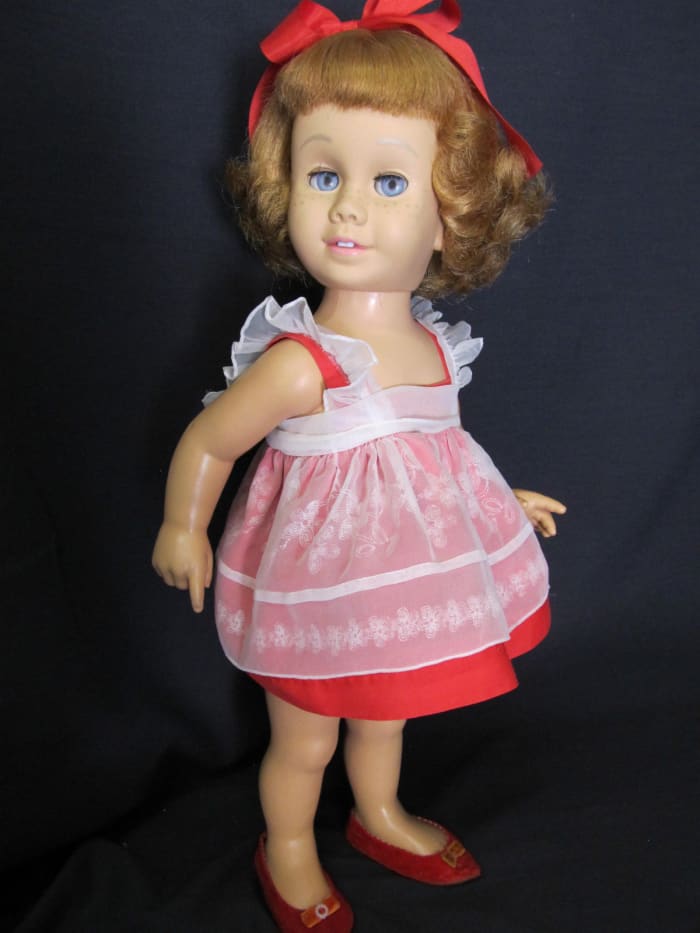 1960 Chatty Cathy, she is a prototype, with strawberry blonde hair, and blue eyes, with the Mamie Eisenhower flip hairstyle, bought right out of the Harvey's Department Store window before Christmas back in 1960, she even had her own highchair.