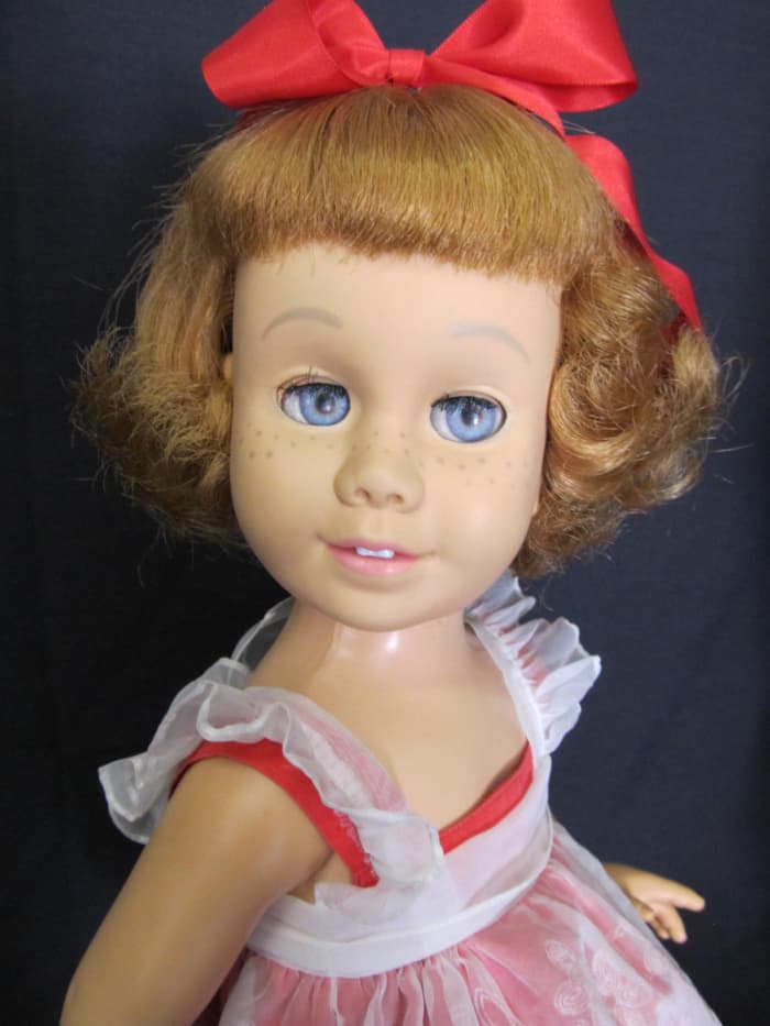 She is called a "prototype" as the first dolls were not marked on either the head or body. She is hard vinyl with a soft vinyl head and a fabric covered grill in the chest. Her neck turns and all joints work easily.