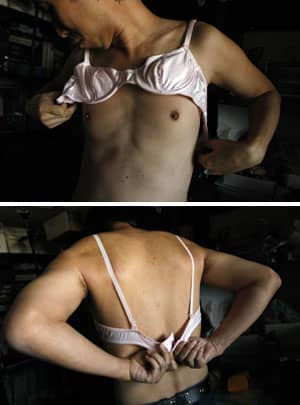 Below: Wishroom Representative Director Masayuki Tsuchiya puts on his companys mens bra in Tokyo November 22, 2008. REUTERS/Toru Hanai