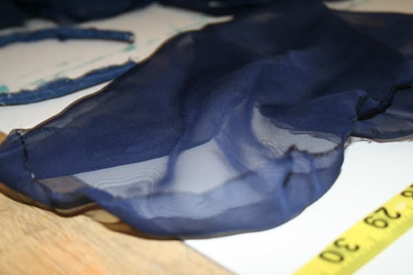 I randomly glued blue cotton material around the plastic headband. The next layer would somehow be made with this blue chiffon material--I just wasn't sure yet how.