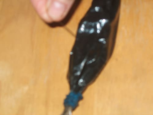 Poking many holes in it with a pin to simulate the colon's drying action. This didn't work very well.