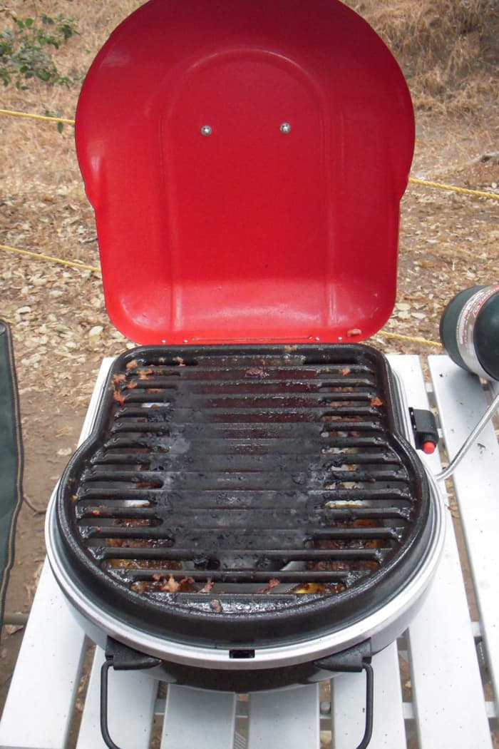 The grill after cooking sixteen hamburgers. It cleaned nicely at the campsite and the grill plate got really clean after a spin in the dishwasher at home.