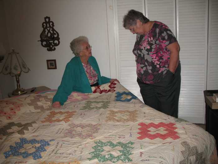 The colored sections of the quilt are made with printed 1930s fabrics.