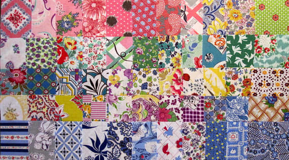 This shows the wide variety of patterns and colors that the feedsacks came in. Woodstone Studio has batches of them already cut into squares to delight quilters.