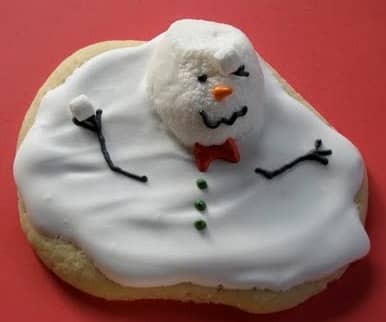 Melted snowman cookie with a marshmallow face.