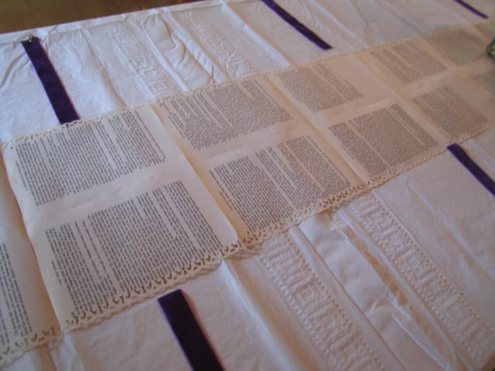 Here's the table runner. Look at the decorative edges they added using scrapbooking punches. Between each place, she put a handmade velvet bookmark too. It was a delightful wedding