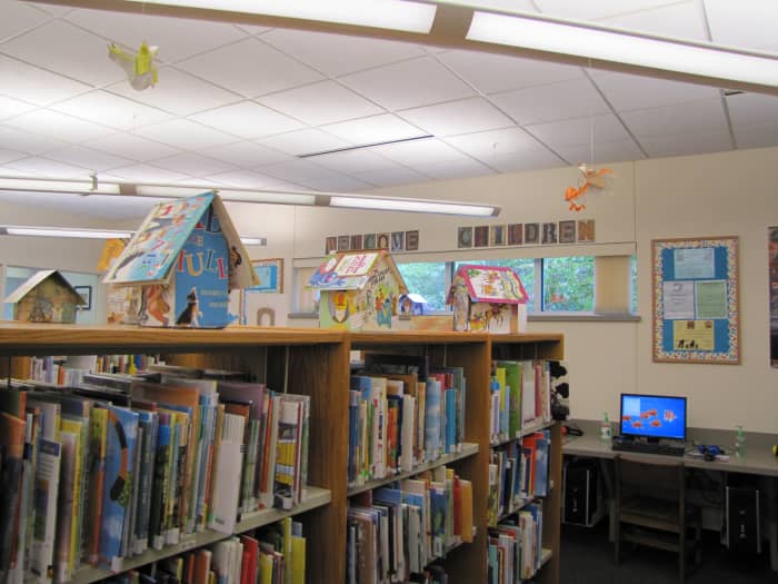 I don't know if this is the work of the librarian or an artist or if they used old books for a children's craft program. Eye-catching for sure.