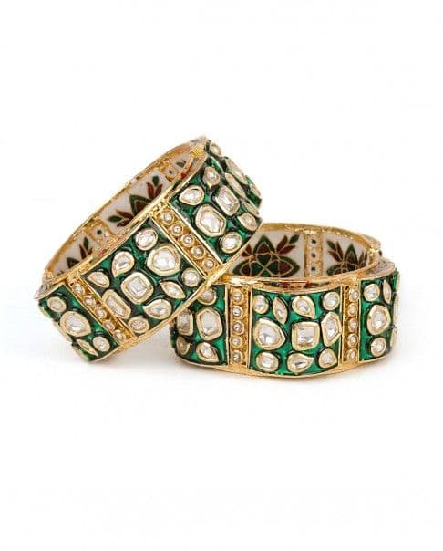 Gorgeous jaipuri design gold bangles with kundan and green meena painting on the outside and maroon and white floral meenakari inside the bangle