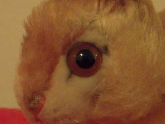 The pensive rabbit has beautifully detailed eyes. The mohair section between the eyes is a darker color, which effectively hides the seams.
