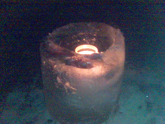 From the photographer: “There was this bucket of water in the garden . . . and then we had frost . . . So we drilled a hole in the ‘water’ and put a candle in it. (All swedes have ice drills, of course)”