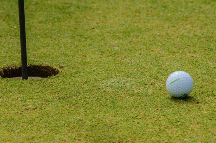 So the preacher swings his club and the ball goes three hundred yards and lands only a few inches from the hole.