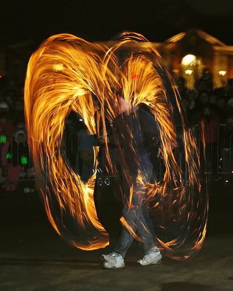 Poi is a form of juggling originated by the Maori people in New Zealand. This photograph of fire poi was taken by Paul Keleher on December 31, 2007.