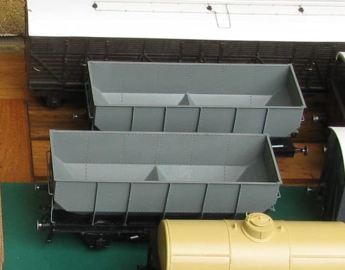 A batch of vehicles including GW Siphon (rear), ex-LNER 20 ton Dgm 100 hoppers (middle) with early tank wagon (fore). No doubt we will see the finished product with time.