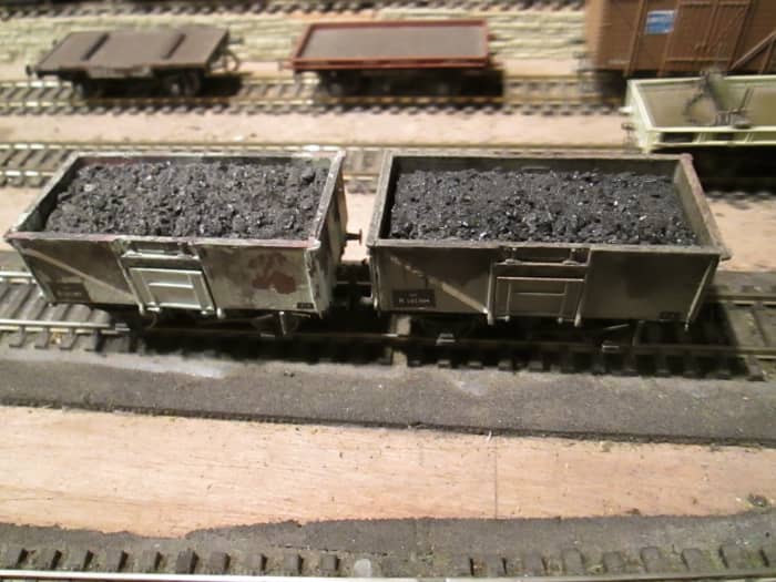 Early in British Railways days a new steel mineral wagon was built at various sites by BR and contractors to the 16 ton pattern to replace older 12 and 13 ton wooden wagons. (Dapol/ Airfix kits with removable coal loads, topped by real coal on pva)