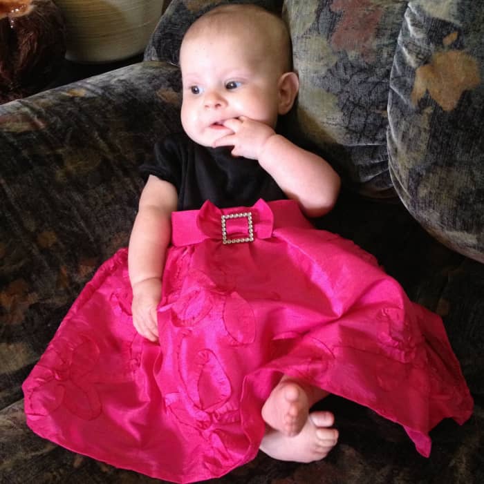 Our baby girl in her new first Christmas dress.