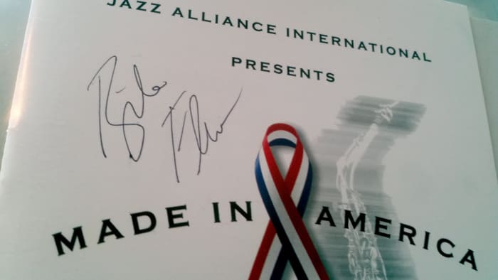 Program cover signed by jazz artist Bela Fleck (from NYC) at a huge fundraiser at Town Hall (on December 5, 2001).