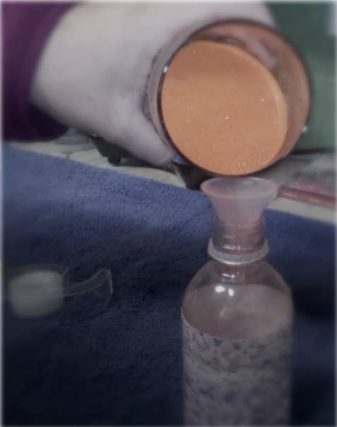 I bought orange sand at a craft store because it is our school color. I also bought a tiny funnel perfect for filling the bottle.