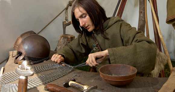 Weaponmaster at work on chain mail - Viking Centre, Ribe, western Jutland (Denmark)