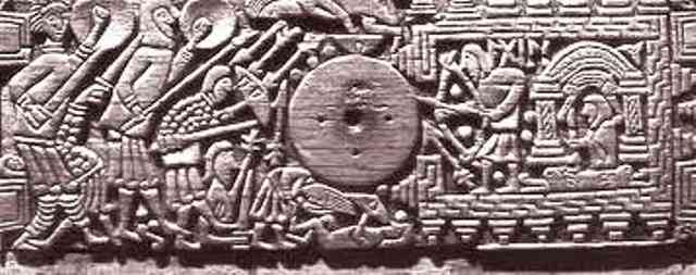 Norse carving of Volund (Wayland in English) the smith making weapons as his paymaster Egil fights off attackers