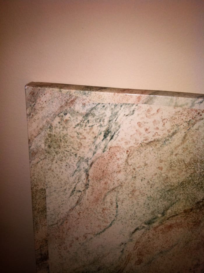 Back/bottom side of the table-top, showing noticeable seams but providing a nice finishing touch.