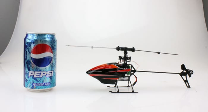 Here's the WLToys V922 next to a can of 12 oz Pepsi... Yes, it's that small, and yes, it's a full 6 CH bird.