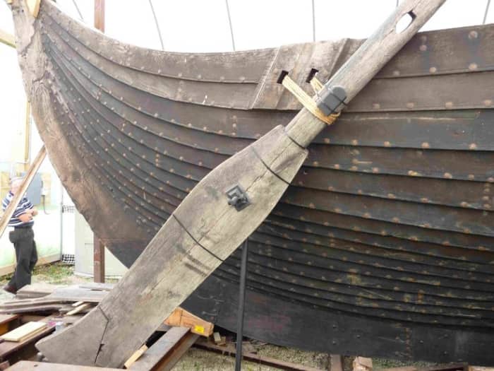 The steering oar or tiller, 'Sea Stallion', set on the starboard quarter - starboard comes from 'steerboard'