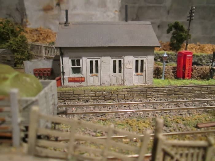 Short version of an archetypal lap-board North Eastern platform building with booking office, waiting room and ladies room - outside gents on the left, where the fire buckets are ranged along the wall