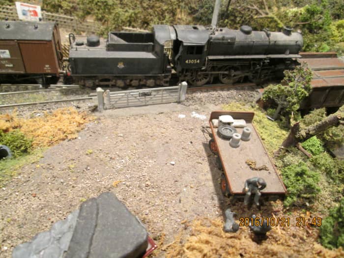 On her way through Ayton Row with a fitted branch goods, 43054 passes the occupation crossing... Is that driver still sat on the back of that trailer, gassing to his mates? No, sorry, it's a delivery drivers' meeting again.