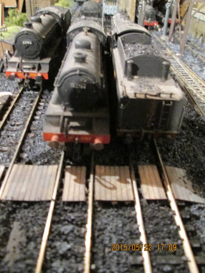L-R, 1980's Hornby D49 62700 almost out of sight, Almost on the 'Poppy's timber barrow crossing are modified D49/2 62764 'The Garth' (from D49/1) and Bachmann WD 2-8-0 90446 (see below for contact link to Poppy's for a list of balsa model products)