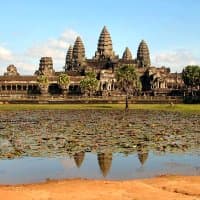 The Angkor Wat temple ruins stand at the center of a UNESCO World Heritage Site in modern Cambodia. Built in the twelfth century, it remains the largest religious building in the world.