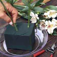 This is floral foam often used in an arrangement. It must be kept damp at all times or your flowers will wilt