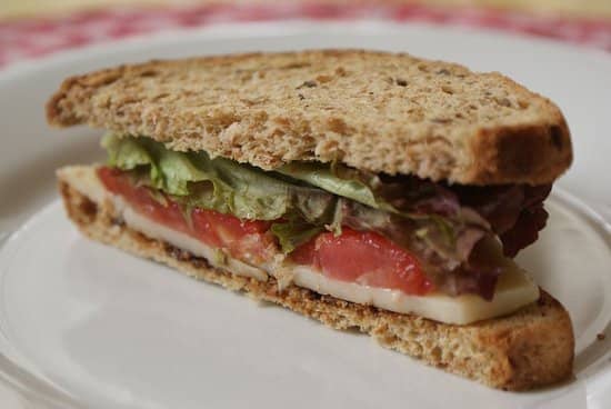 A Vegemite and salad sandwich. You can use a thin layer of Vegemite to your slices of bread before you add your desired salad fillings to give a slightly salty flavour to your sandwich.