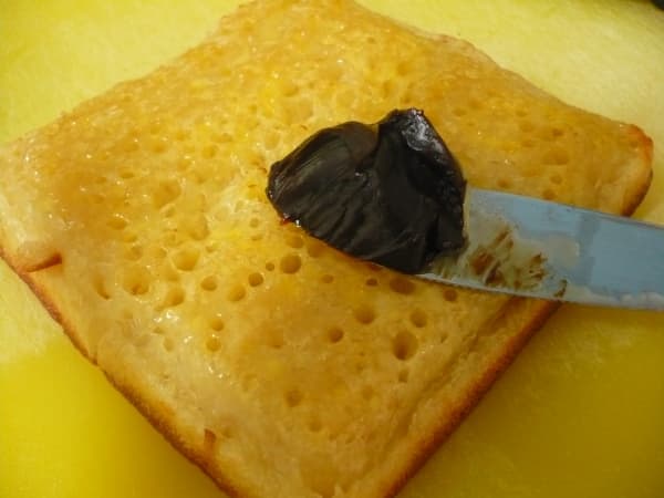 Spread Vegemite over a fresh crumpet with butter or margarine. The hot crumpet will melt the butter gloriously ready for a layer of Vegemite goodness!